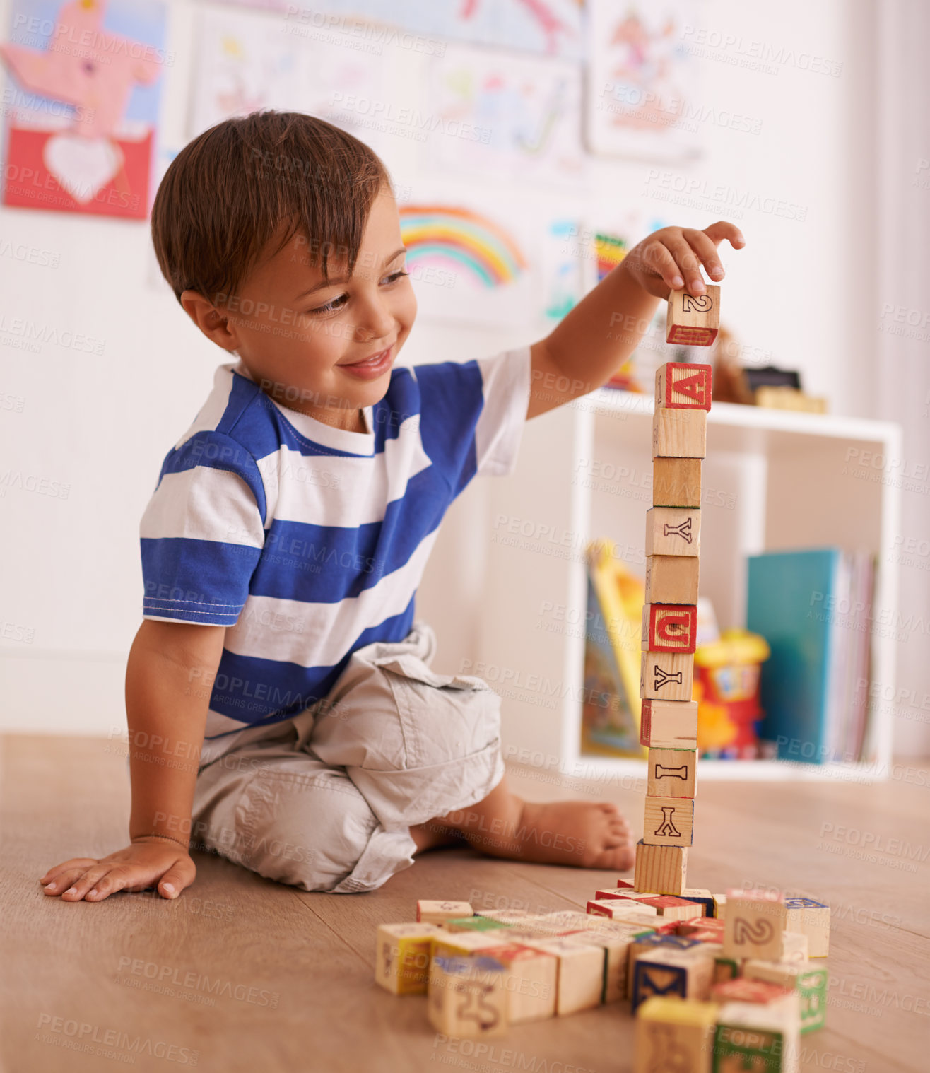 Buy stock photo Home, boy or child with building blocks for playing and learning for development or growth in playroom. Happiness, education and playful with activity, young toddler kid and fun games for creativity 