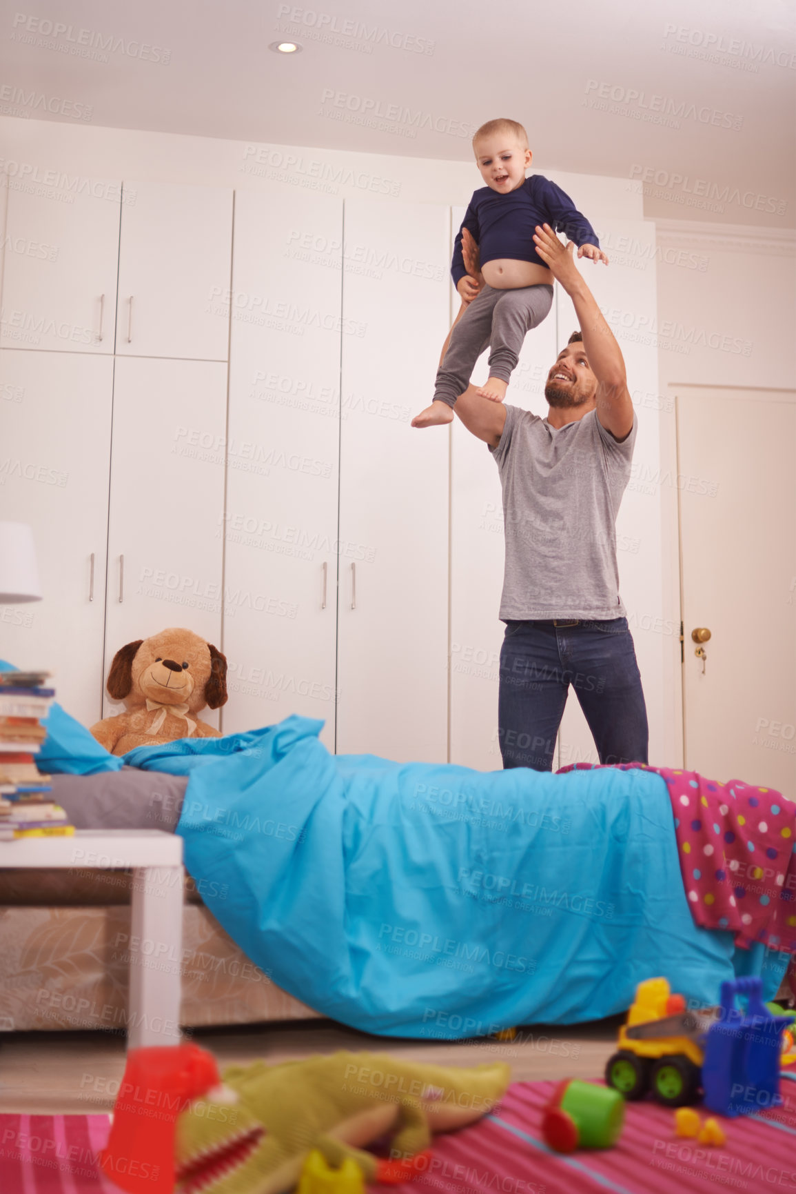 Buy stock photo Father, child and plane in bedroom with playing for bonding, healthy relationship and happiness in home. Family, dad and infant son with lifting, smile and playful in apartment with love and care