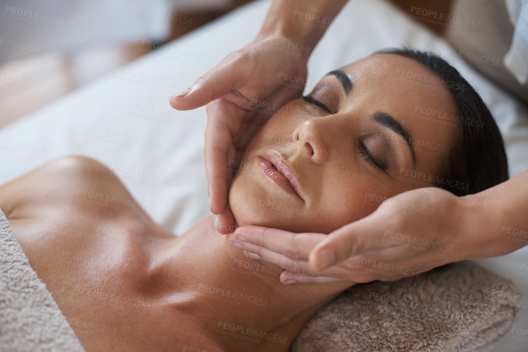 Buy stock photo Shot of an attractive woman enjoying a face massage
