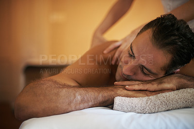 Buy stock photo Relax, massage and man at hotel spa for health, wellness and balance with luxury holistic treatment. Self care, vacation and person on bed for muscle therapy, comfort and zen with body pamper service