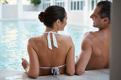 Buy stock photo Vacation, hotel and couple relax in pool for swimming, man and woman together with happiness for honeymoon. Resort, female person and guy smile for love in marriage, bonding and girl with bikini