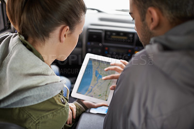Buy stock photo Couple, car and map on road trip with navigation for direction, vacation and travel to destination in countryside. Woman, man and tablet in vehicle for tech or location to holiday journey and tourism