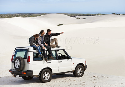 Buy stock photo Friends, people on car in desert and travel for tourism in Dubai for safari, road trip and view. Adventure, journey and transportation with offroad vehicle or 4x4 on vacation for break outdoor