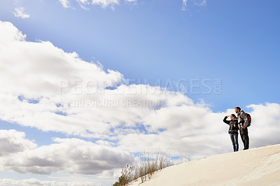 Buy stock photo Travel, love and couple in desert for location search, view or scenery while bonding in nature. Freedom, adventure or people in sand dunes for journey, hiking or wellness, backpacking or fun in Egypt
