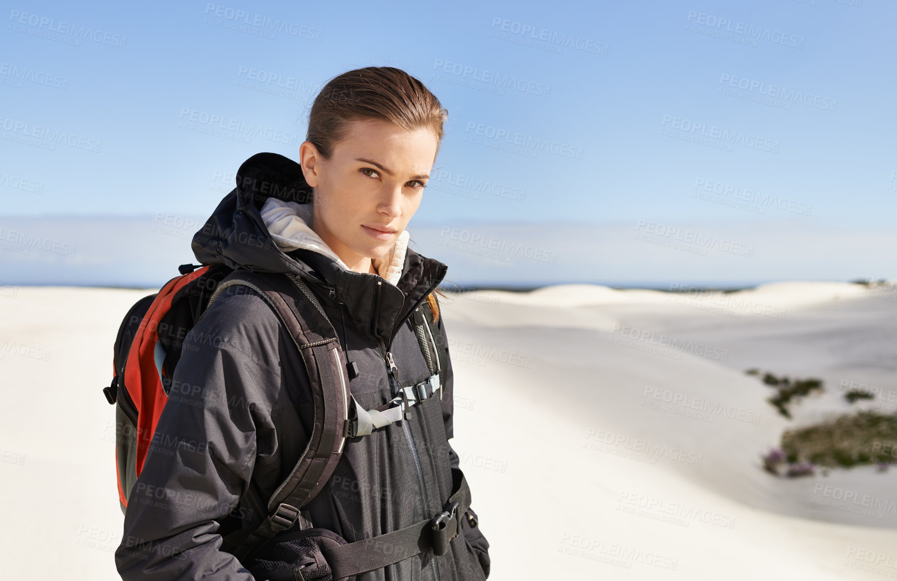 Buy stock photo Portrait, sand dunes or woman in nature to hike for adventure, desert landscape and travel for holiday. Mockup, hiker or nomad explorer in Sahara terrain, outdoor and dry climate for view or scenery