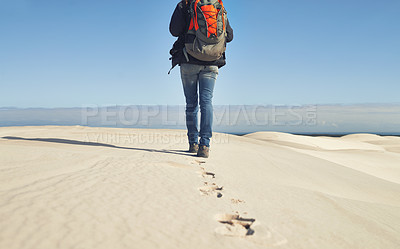 Buy stock photo Walking, sand dunes or legs of person  for adventure, desert landscape and travel for holiday vacation trip. Back view, hiker and nomad explorer hiking in Sahara terrain, outdoor and dry climate