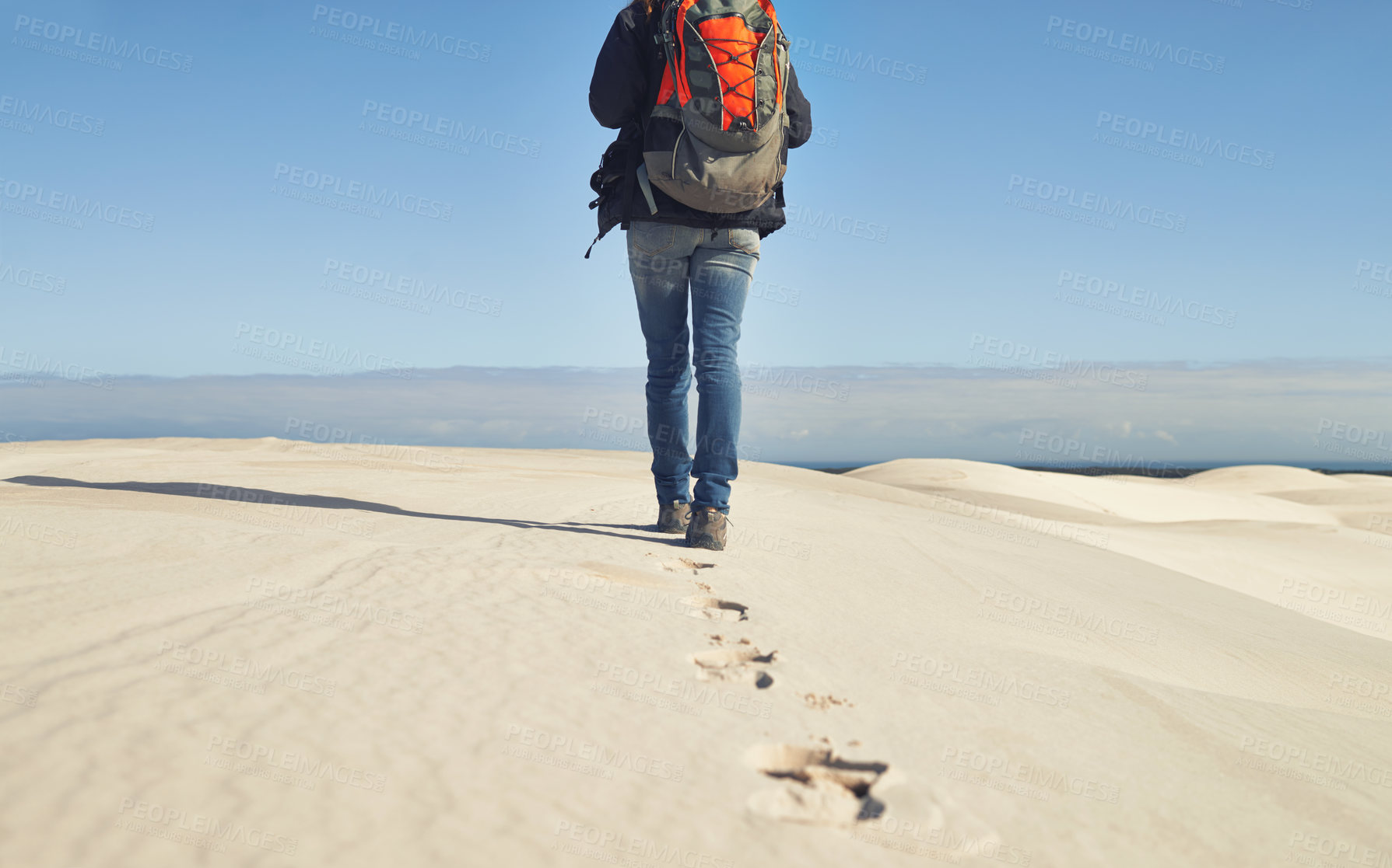 Buy stock photo Walking, sand dunes or legs of person  for adventure, desert landscape and travel for holiday vacation trip. Back view, hiker and nomad explorer hiking in Sahara terrain, outdoor and dry climate