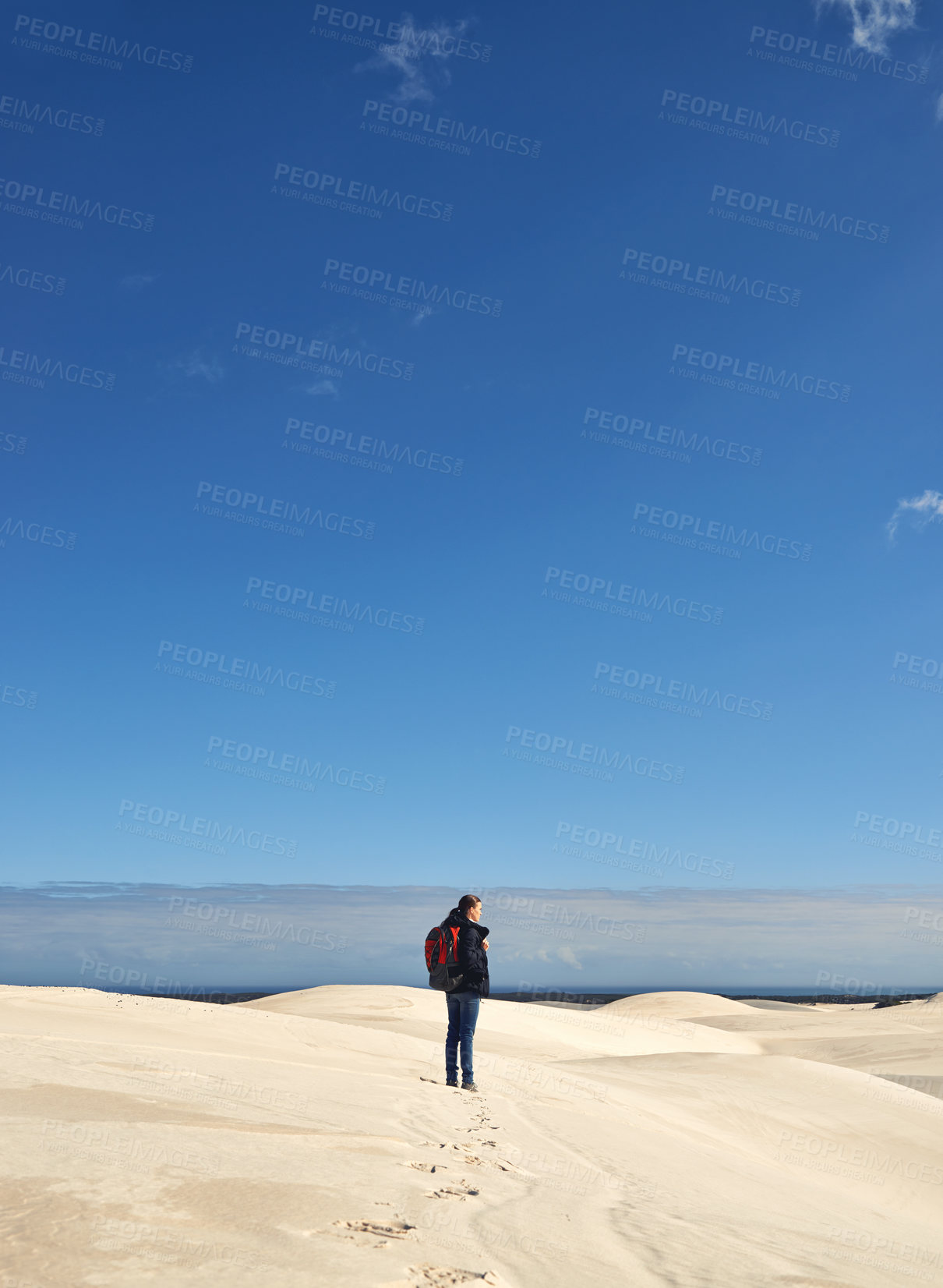 Buy stock photo Hiking, sand dunes and woman in nature for adventure, desert landscape and travel for holiday. Mockup space, explorer and nomad person in Sahara terrain, outdoor and dry climate for view or scenery
