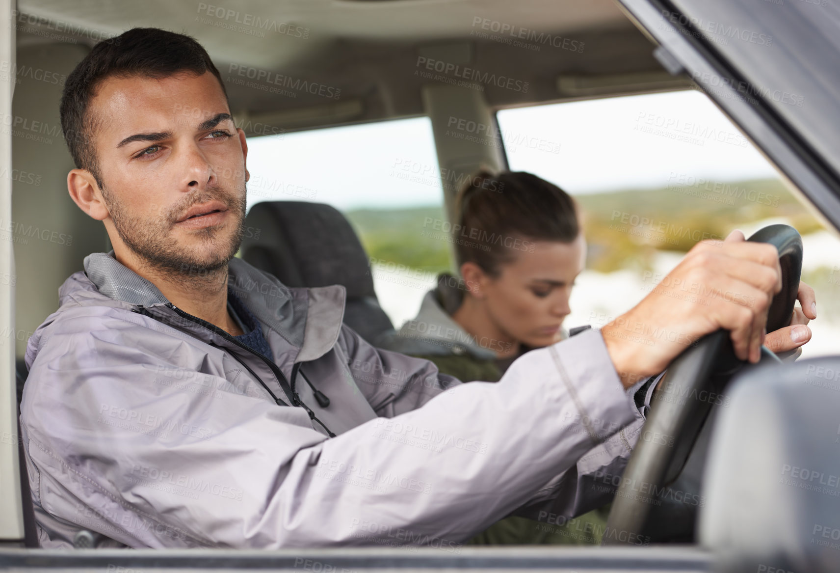 Buy stock photo Couple, car and driving on roadtrip with travel for adventure, vacation and concentration of driver in countryside. Woman, man and serious in transport for holiday journey, tourism and honeymoon trip