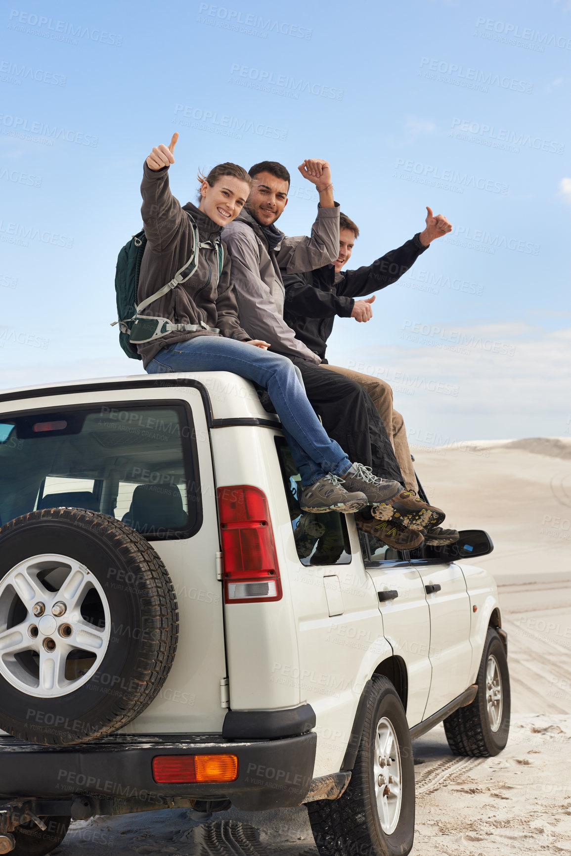 Buy stock photo Road trip, friends and thumbs up on suv, portrait and route for sightseeing and driving adventure in nature. People, traveller and happy face on holiday by blue sky, journey and leisure on vehicle