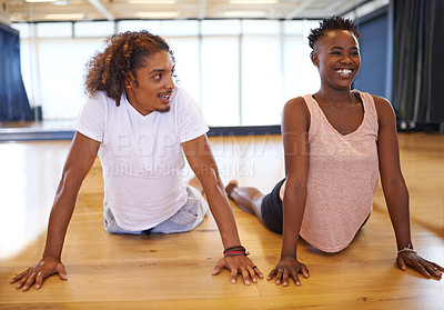 Buy stock photo Dance, studio and people stretching on floor with happiness in class to start practice or rehearsal in academy. Healthy, students and exercise on ground for fitness with pilates or yoga in school