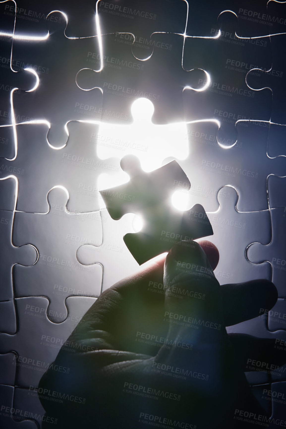 Buy stock photo Hand, missing jigsaw puzzle and glow with light for problem solving, ideas and connection. Person, brain power and games with strategy, innovation or synergy for solution, link or creativity for goal