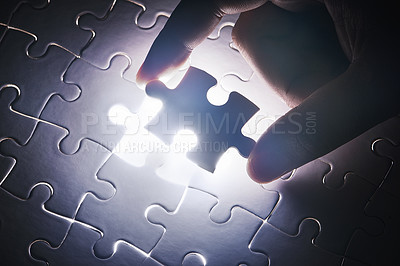 Buy stock photo Conceptual shot of a person's hand building a puzzle
