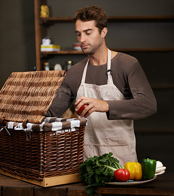 Buy stock photo Man, basket and business owner with vegetables or groceries in a bag for cooking or diet in kitchen. Chef packing, shopkeeper and person sorting healthy food dinner or packaging box of ingredients