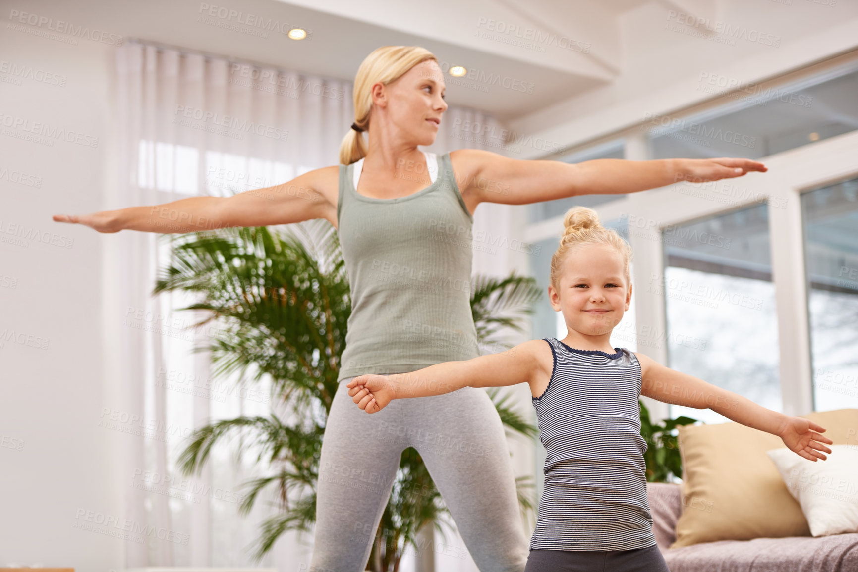 Buy stock photo Full length shot of a mother and daughter doing yoga together