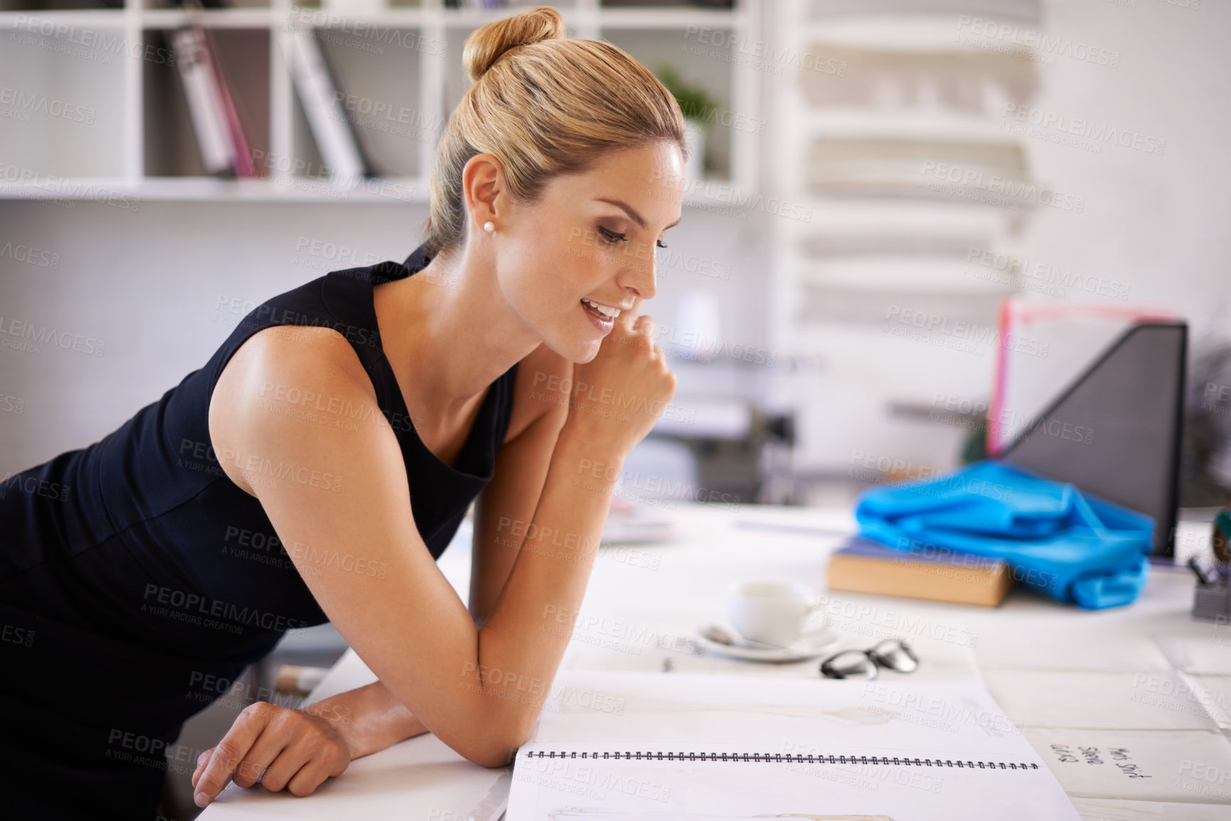 Buy stock photo Fashion designer, woman and sketch for ideas, production and brainstorming at her desk in workshop. Young worker, tailor or artist with book or drawing for clothes, manufacturing and textile business