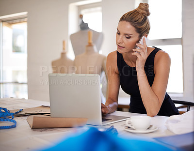Buy stock photo Designer, woman and phone call in studio for fashion with laptop, typing and communication for deal. Person, smartphone and computer with conversation, negotiation or contact for material in workshop