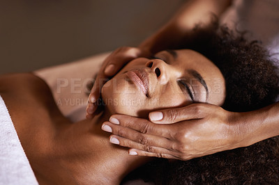 Buy stock photo Shot of a young woman getting a head massage at a beauty spa