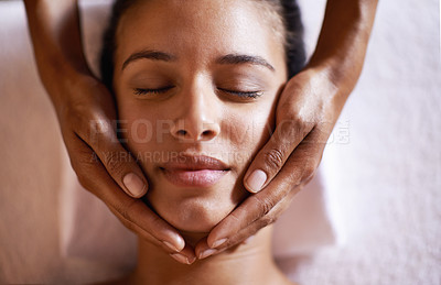 Buy stock photo Woman, relax and face massage at spa with hands and care for facial, wellness and beauty treatment on bed. Above, towel and calm african female woman with skincare and rest at hotel with skin glow 