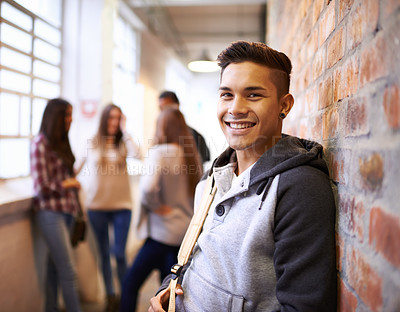 Buy stock photo Education, smile and portrait of student in college hallway for studying, learning and scholarship. Future, happy and knowledge with man leaning against wall for university, academy and campus