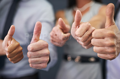 Buy stock photo Closeup shot of a group of professional coworkers giving thumbs up