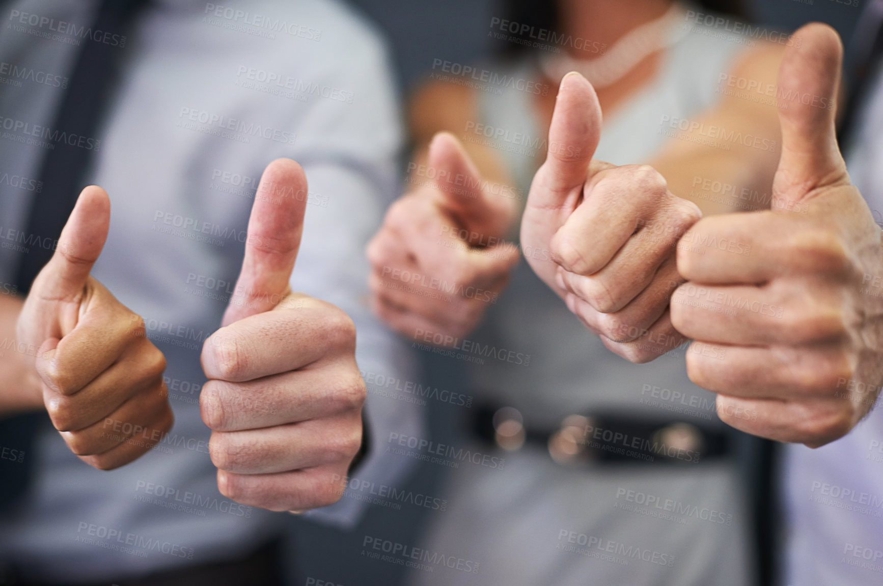 Buy stock photo Closeup shot of a group of professional coworkers giving thumbs up