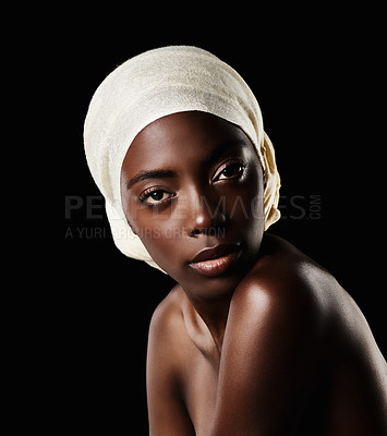Buy stock photo Serious, portrait and black woman with head wrap, natural makeup or creative beauty aesthetic in studio. Art, skincare and African girl on dark background with scarf, facial cosmetics and confidence.