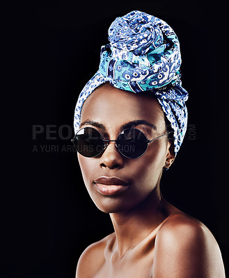 Buy stock photo Portrait, fashion and sunglasses with African woman in studio isolated on black background for heritage. Aesthetic, face and tradition with confident young person in trendy headwear for style culture