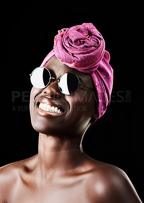 Buy stock photo Face, turban and smile with black woman in studio isolated on dark background for heritage. Fashion, model and sunglasses with confident African person in trendy headwear for traditional style