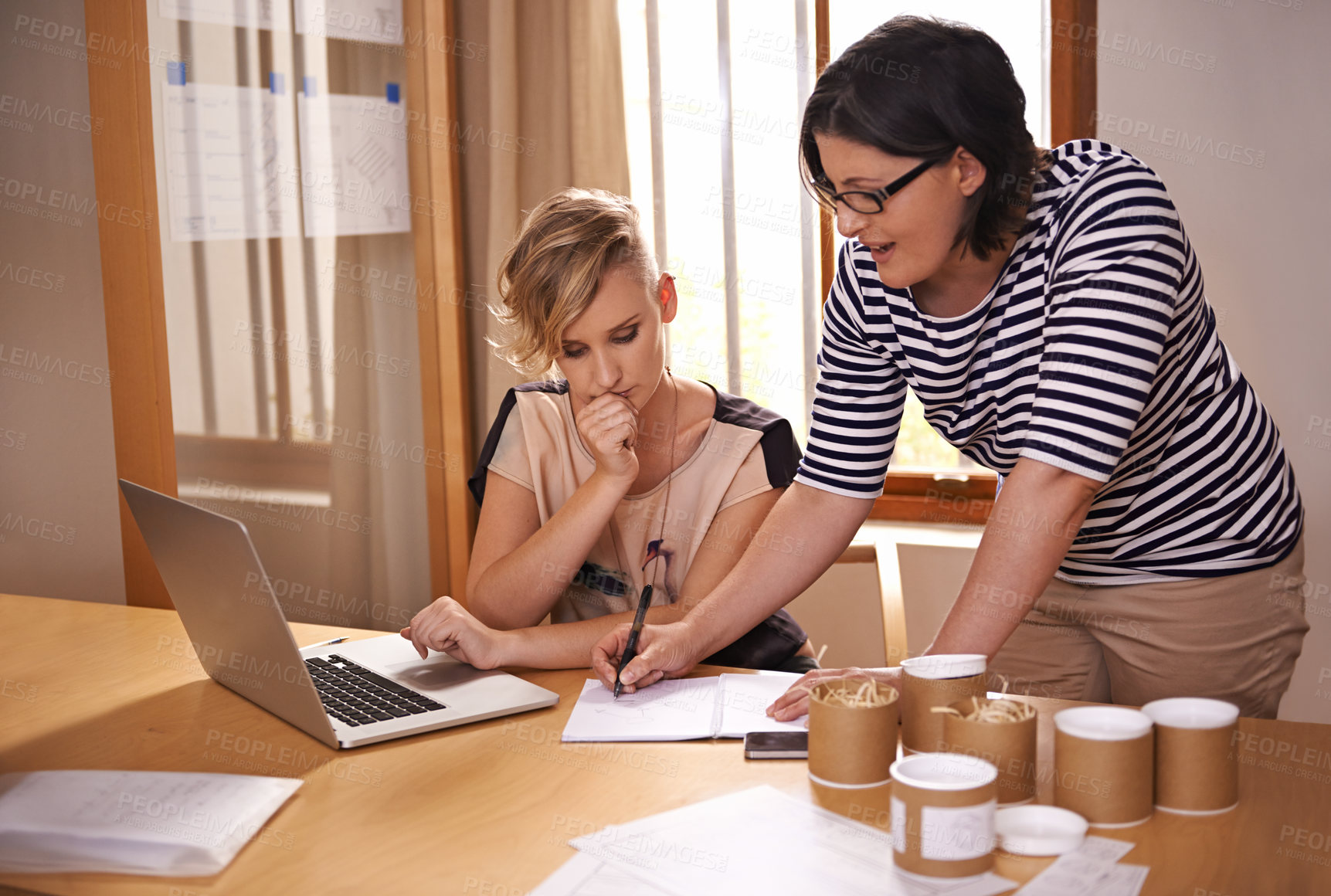 Buy stock photo Collaboration, laptop and writing with creative women in office together for planning or strategy. Computer, thinking and teamwork with designer people in startup business for research or discussion