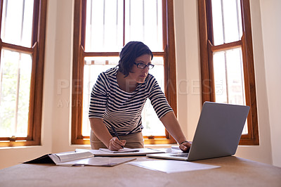 Buy stock photo Businesswoman, laptop and notes at desk, office and technology for startup business owner. Entrepreneur, research and computer for female designer, writing and notebook for project in workplace