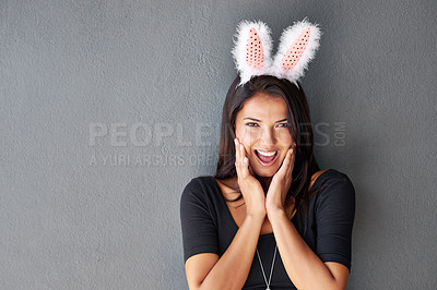Buy stock photo Bunny ears, space or portrait of woman on easter holiday isolated on wall or grey background with style. Happy model, confident lady or excited person in studio with smile, joy or announcement mockup