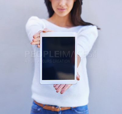 Buy stock photo Tablet, show and hands of woman in studio background, smile and happiness for mobile and media. Presentation, female person and girl with digital device, mockup and screen of technology and internet