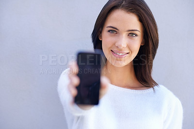 Buy stock photo Portrait, smile and woman with phone, presentation and product placement for advertising mobile. Studio background, female person and girl with happiness for cellphone, digital and technology