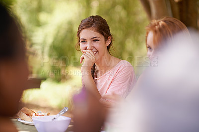 Buy stock photo Teenager, happy friends and eating food outdoor at party for celebration together at park in summer. Group, students and lunch at table in garden, talk and girl laugh at funny conversation on picnic