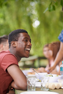 Buy stock photo Black man, happy friends and eating lunch at garden for party or celebration together at park in summer. Group, students or food at table outdoor, talking or teenagers laugh at conversation on picnic