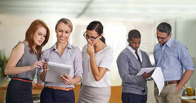 Buy stock photo Diverse team of successful business people working in a modern office. Men and women collaborate and discuss work in groups, creating teams for different projects in the workplace over copy space.