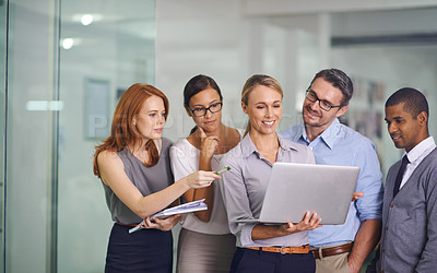 Buy stock photo Manager with laptop showing, training or presenting strategy ideas or brainstorm plans with diverse group of office colleagues. Confident, smiling or happy leader updating team of staff on technology