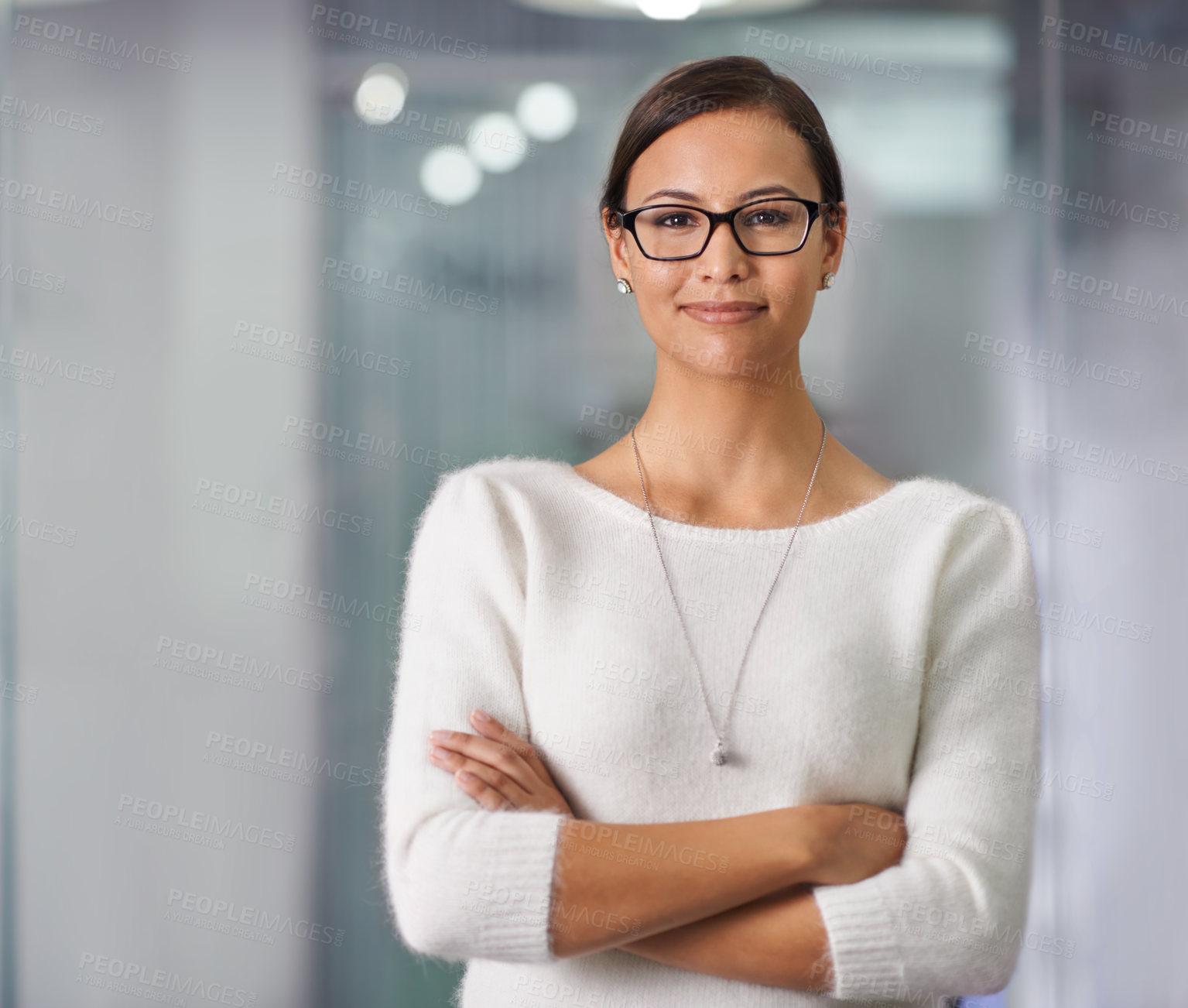 Buy stock photo Cropped portrait of a young businesswoman standing in an office