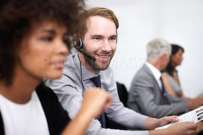 Buy stock photo Call center, smile and man in office with headset working on online telemarketing consultation. Happy, customer support and professional male consultant with crm service communication in workplace.