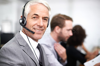 Buy stock photo A friendly customer support agent answering the phone