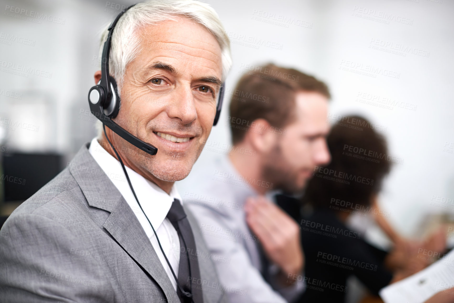 Buy stock photo A friendly customer support agent answering the phone