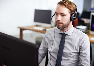 Buy stock photo Call center, customer support and man in office with headset working on online telemarketing consultation. Career, ecommerce and male consultant or agent with crm service communication in workplace.