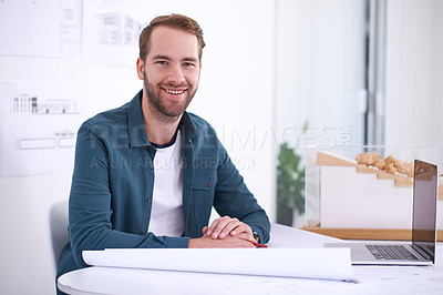 Buy stock photo Portrait, smile and blueprint with architect man in office with documents for building, design or planning. Architecture, construction and laptop with confident young developer in creative workplace