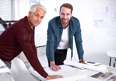 Buy stock photo Cropped portrait of two male architects working together in their office