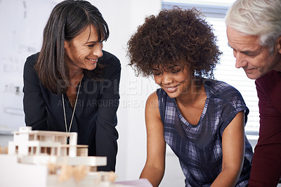 Buy stock photo Architecture, civil engineer and meeting with model for construction, property development or floor plan. Infrastructure, design and diverse group of people in collaboration, teamwork and planning