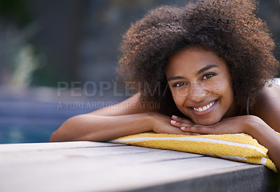 Buy stock photo Attractive ethnic woman lying by the pool