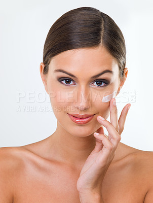 Buy stock photo Woman, portrait and cream for skin with beauty in studio, cosmetics product with hand and makeup on white background. Sunscreen, lotion or moisturizer for facial, antiaging and skincare treatment