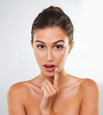 Buy stock photo Woman, portrait and lipstick with makeup for beauty or skincare on a white studio background. Face of attractive female person, brunette or model with cosmetics for facial treatment, glow or shine