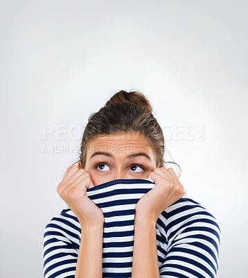 Buy stock photo Scary, woman and hide face with fear or anxiety in studio, white background and mockup space. Surprise, horror and emoji person thinking with stress in a crisis or terror from danger in drama